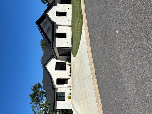 white brick home with black accents